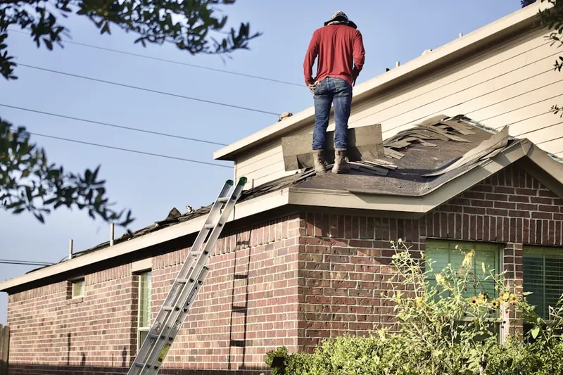 Professional roofer working on a residential roof in Bright Oaks